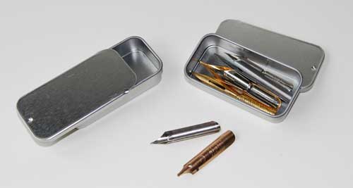 J&T's storage tin showing nibs inside
